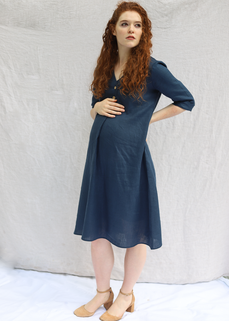 Woman wearing the Faye Dress in softened linen, side view showing the waist tie.