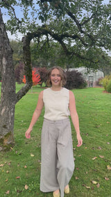 Woman walking and turning in the Gray Adjustable Wide Leg Dress Pant, showing front, side and back