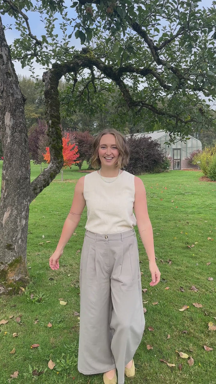 Woman walking and turning in the Gray Adjustable Wide Leg Dress Pant, showing front, side and back