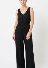 Smocked-Waist V-Neck Linen Jumpsuit in Linen in Black — on model