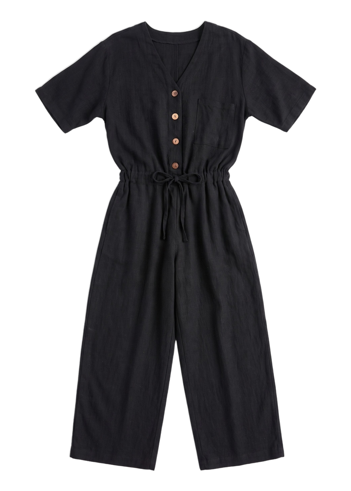 The Easy On/Off Jumpsuit in black sandwashed linen, laid flat.