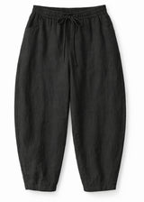Barrel-Leg Under-Bump Drawstring Linen Pants in Linen in Black — flat lay