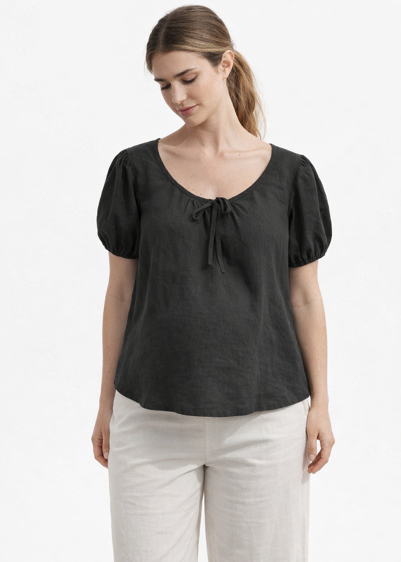 Tie-Neck Puff-Sleeve Cropped Linen Blouse in Linen in Black — on model