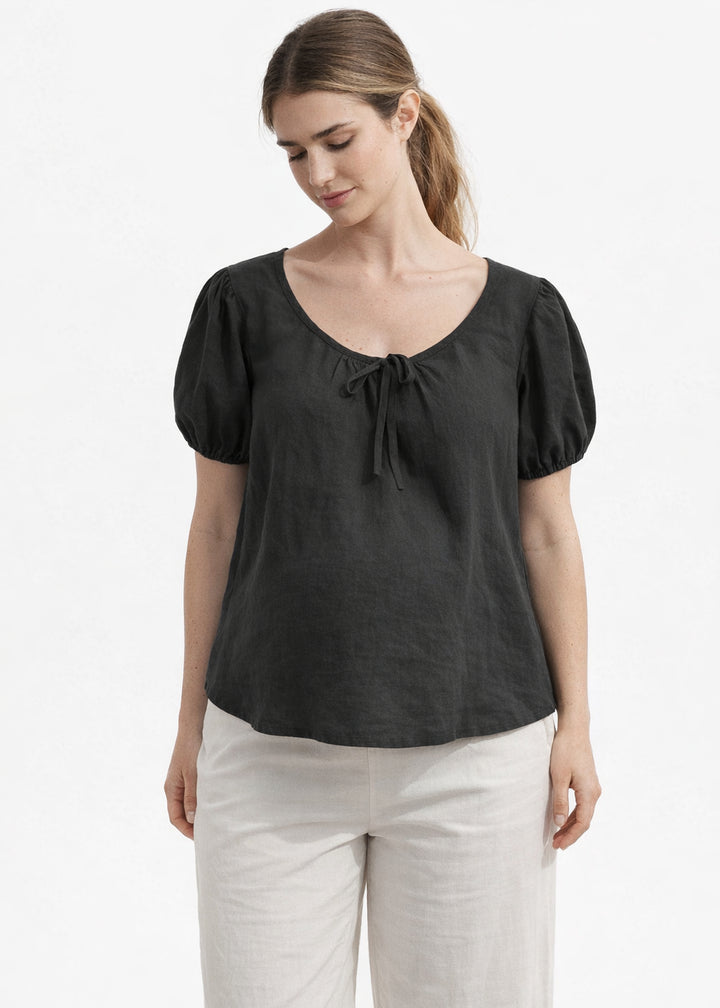 Tie-Neck Puff-Sleeve Cropped Linen Blouse in Linen in Black — on model