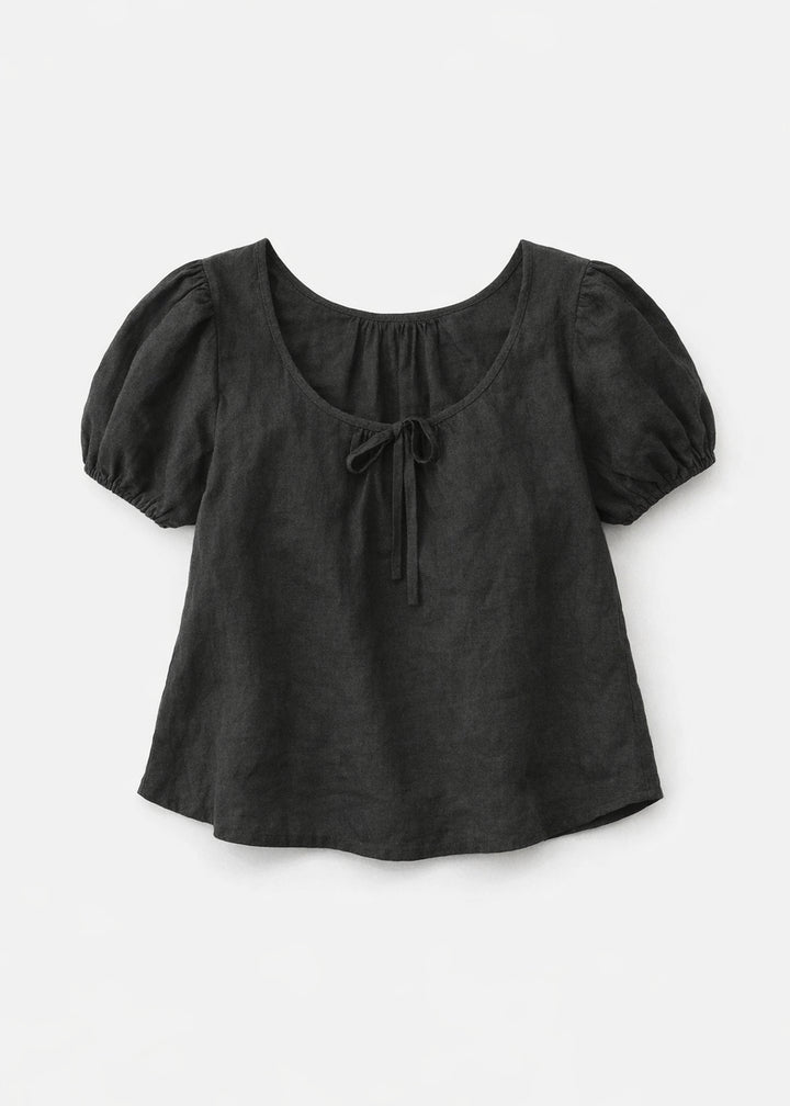Tie-Neck Puff-Sleeve Cropped Linen Blouse in Linen in Black — flat lay